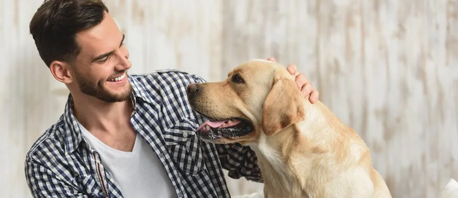 man petting adog