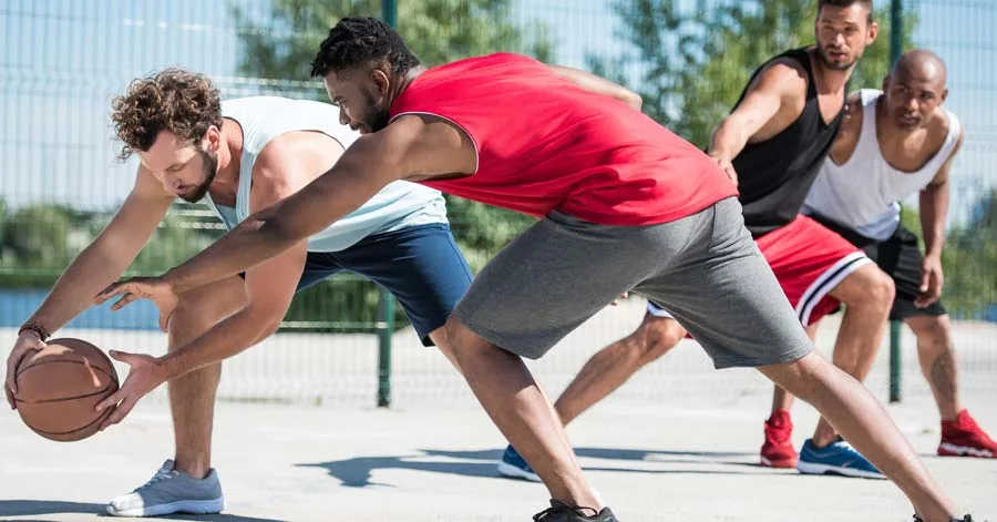 group of men playing basketball