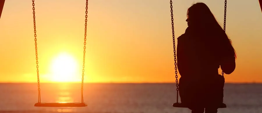 woman alone on a swing