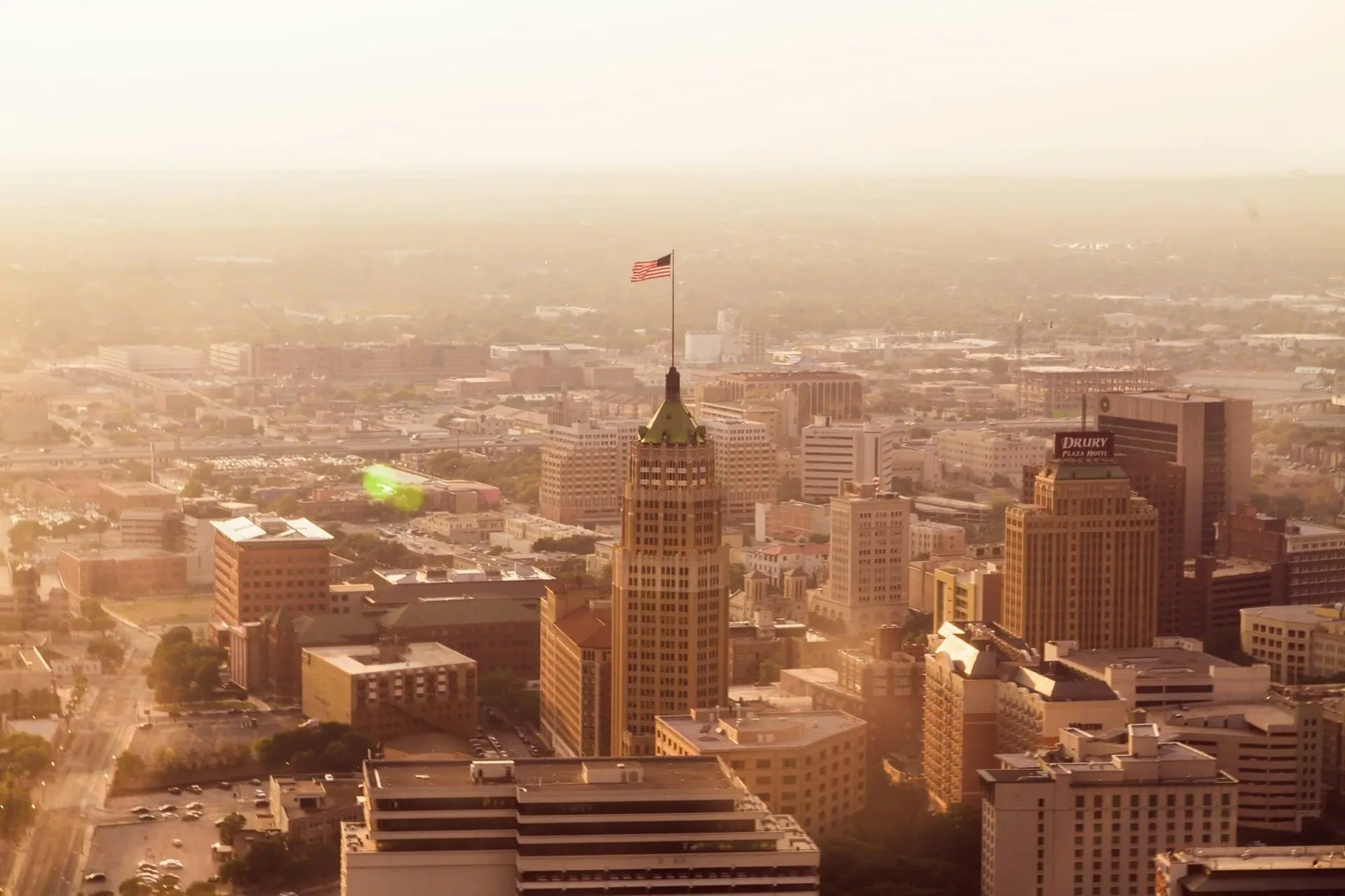 Aerial view of downtown San Antonio skyline at sunset.