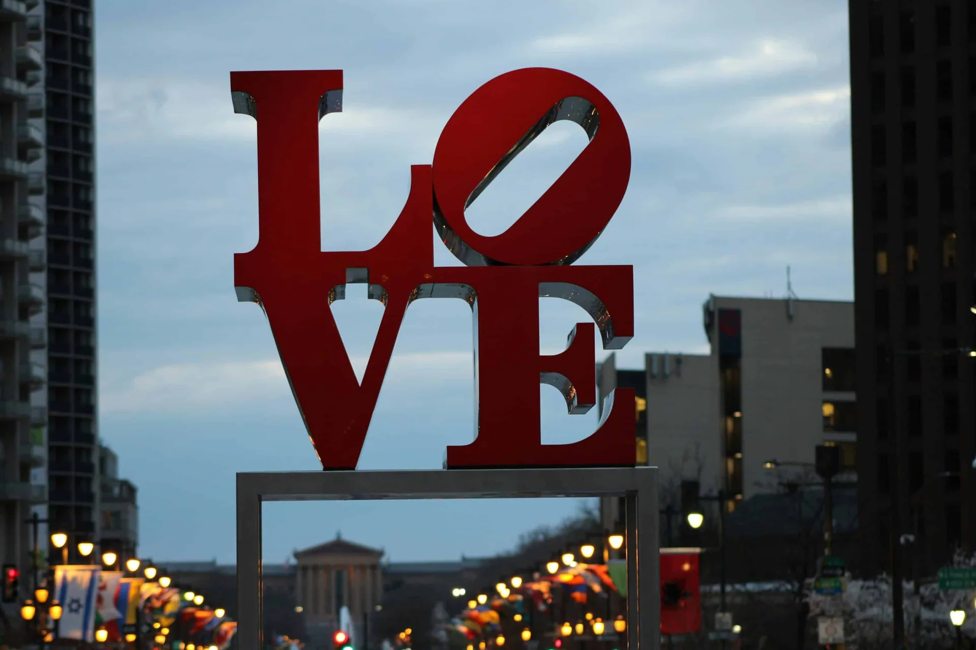 Sober living home in Philadelphia: red ‘LOVE’ sculpture with cityscape backdrop representing Eudaimonia’s men’s sober living environment in Philadelphia, PA.