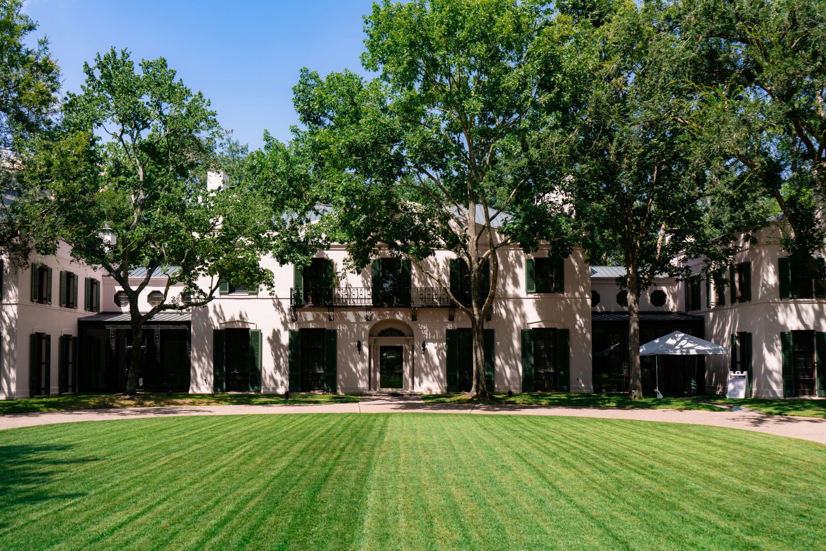 Historic building with landscaped lawn symbolizing structured outpatient treatment programs.
