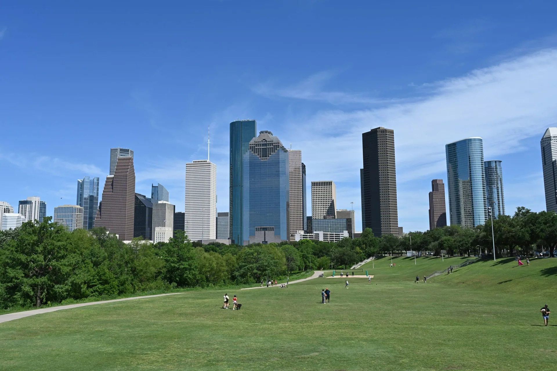 Houston skyline with park symbolizing outpatient recovery and community support.