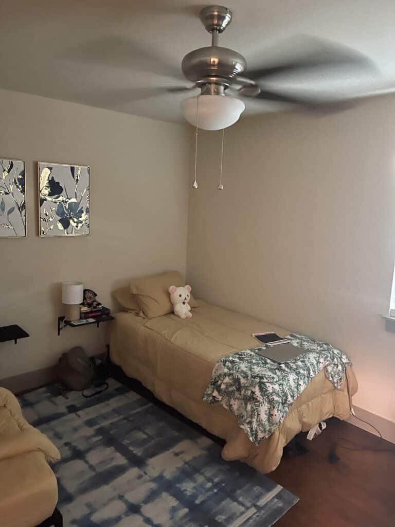 Cozy single bedroom at Quail Meadow women’s sober living Austin TX with neutral décor and supportive environment.