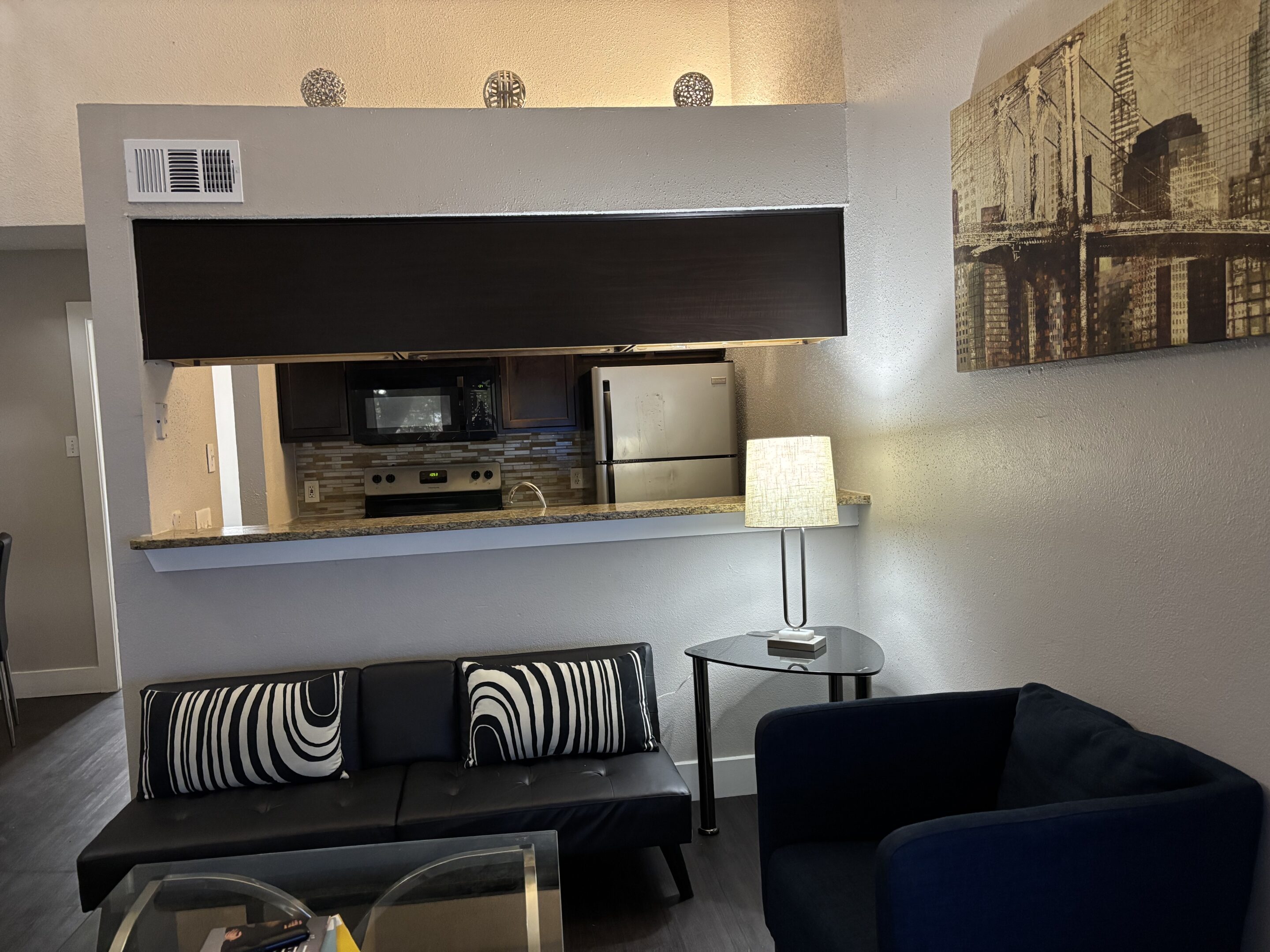 Two-bedroom men’s sober apartment kitchen in Austin with modern furnishings and open layout