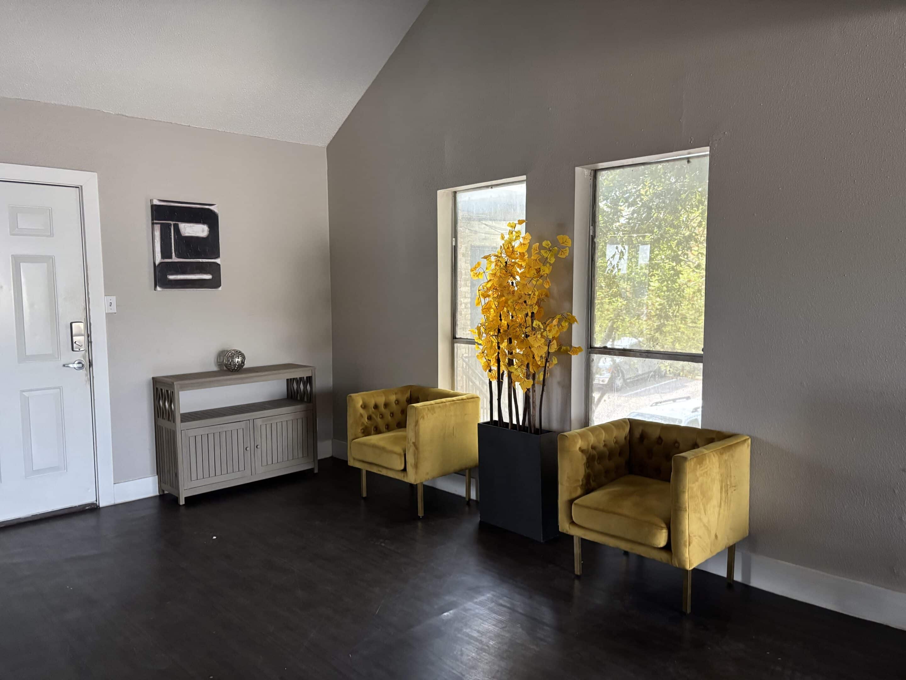 Bunk sober living bedroom in Austin for men with metal bed frames and hardwood floors