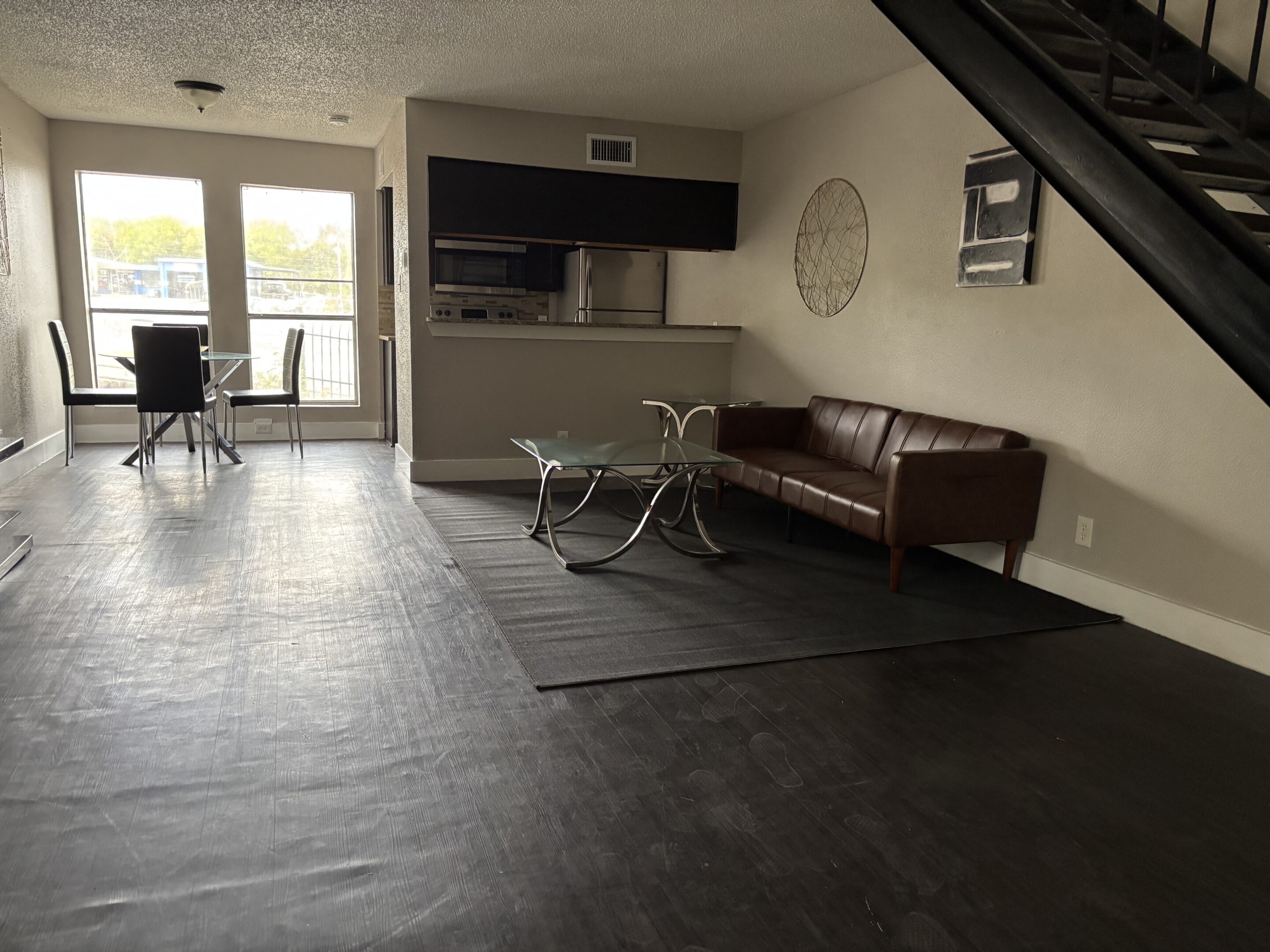 Kitchen and dining area in men’s bunk sober living apartment Austin