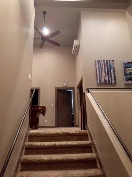 Staircase with a wooden bannister.