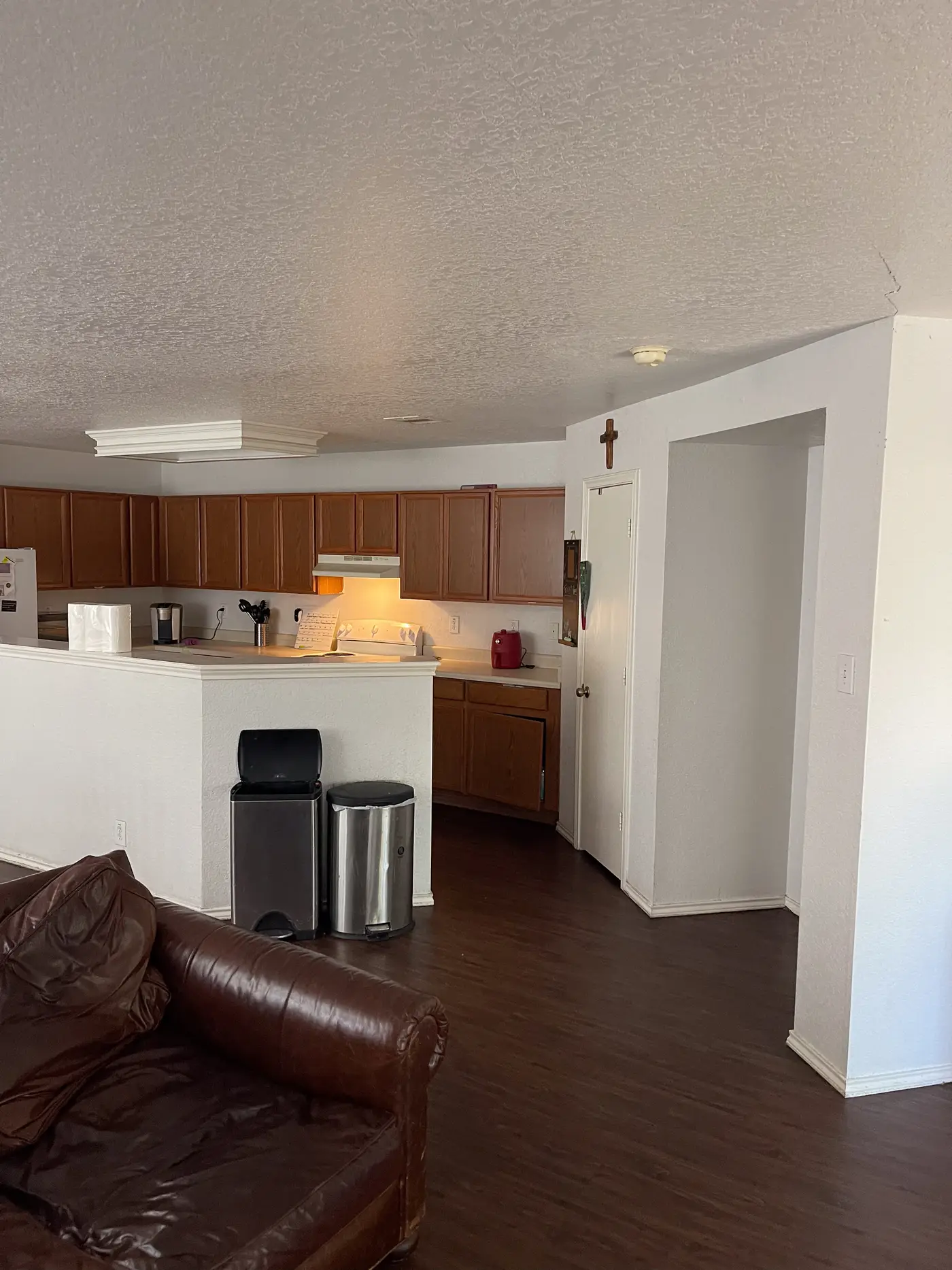 Kitchen breakfast bar seen across the living room.