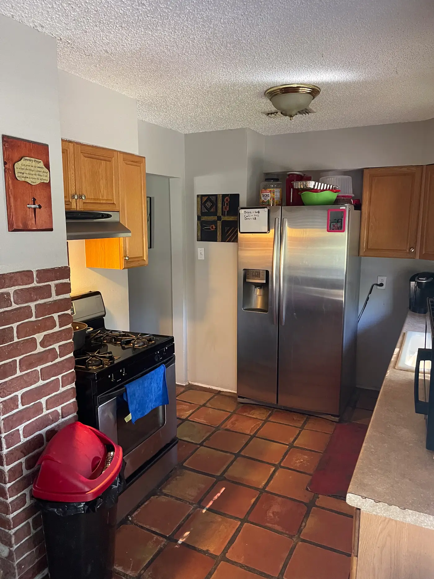 Kitchen with a gas range and a brick surround.