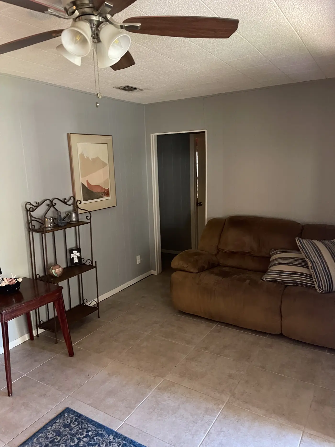 Living room with a sofa and console table by the entrance.