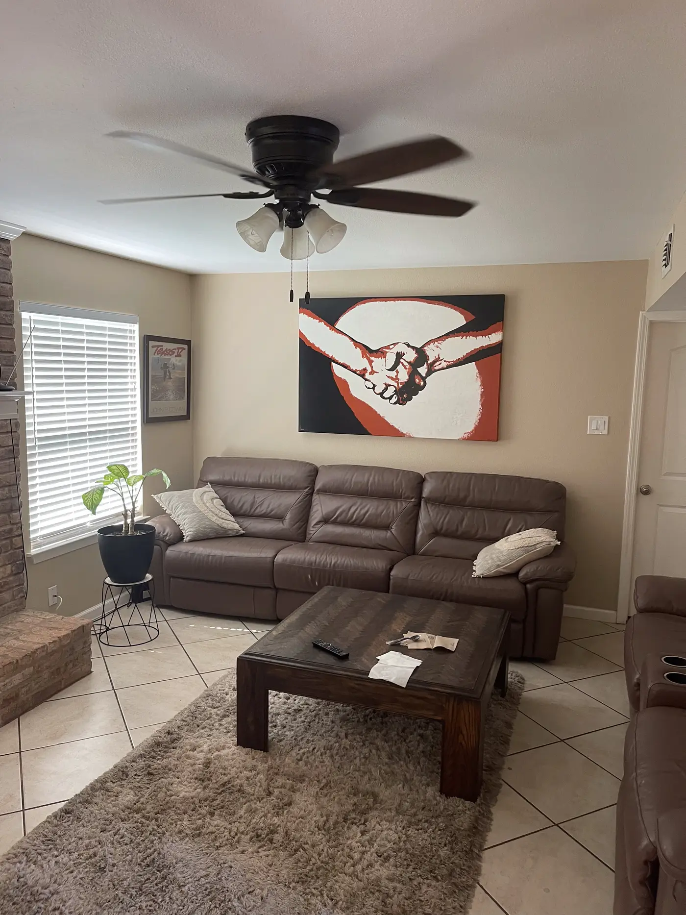 Living room with a sectional and a patterned rug.