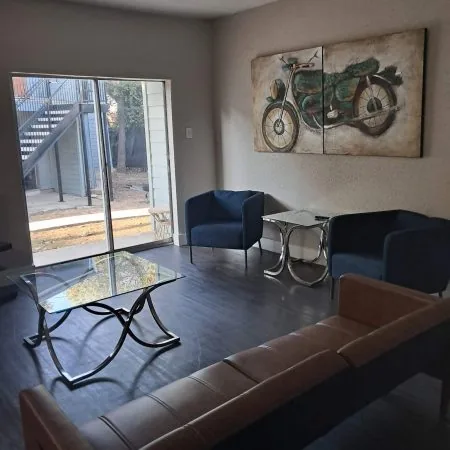 Shared two-man suite sober living in Austin with modern décor, natural light, and comfortable seating