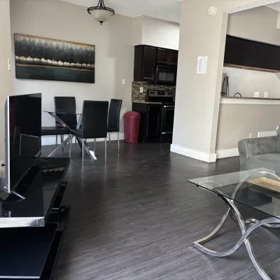 Kitchen and dining area in affordable men’s sober apartment Austin TX