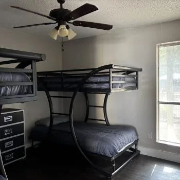Budget men’s sober housing with two bunk sets and natural light in Austin
