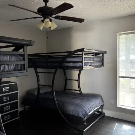 Budget men’s sober housing with two bunk sets and natural light in Austin