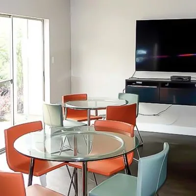 Private bedroom with bed and decor in men’s sober living housing in Austin, TX.